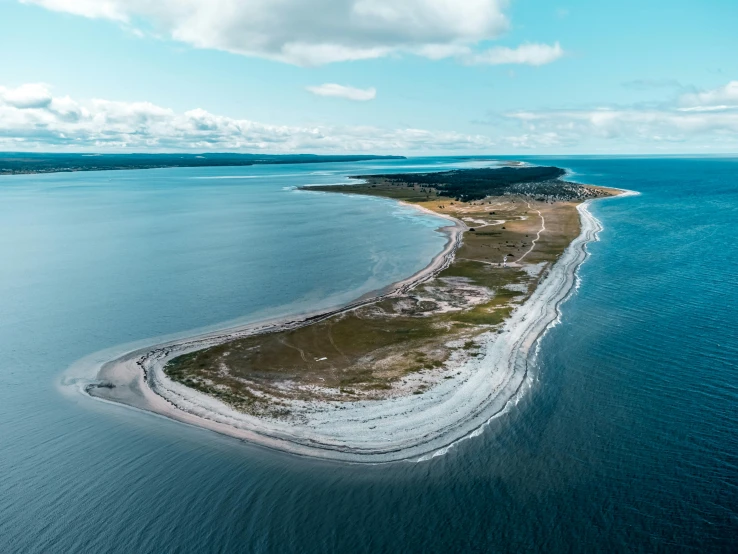 an island in the middle of a body of water, pexels contest winner, land art, ocean shoreline on the horizon, oland, overview, stålenhag