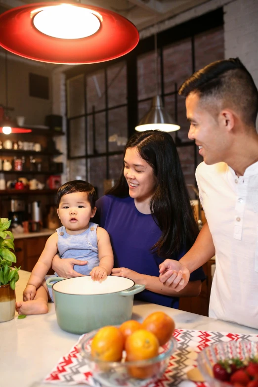 a man and woman in a kitchen with a baby, inspired by Eddie Mendoza, pexels contest winner, ruan jia and brom, ingredients on the table, good housekeeping, sleek design