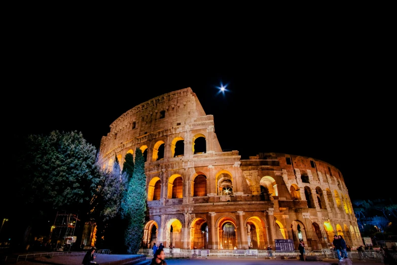 a couple standing in front of the colossion at night, by Giuseppe Avanzi, pexels contest winner, neoclassicism, colosseum, promo image, seen from outside, thumbnail