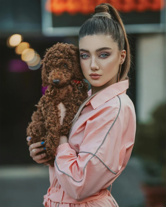 a woman in a pink dress holding a brown teddy bear, a colorized photo, by Julia Pishtar, trending on pexels, beautiful androgynous girl, puppy, model wears a puffer jacket, brown curly hair