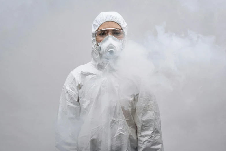 a man in a protective suit smokes a cigarette, by Adam Marczyński, pexels contest winner, hyperrealism, wearing a white hospital gown, dust mask, she is wearing a wet coat, yung lean