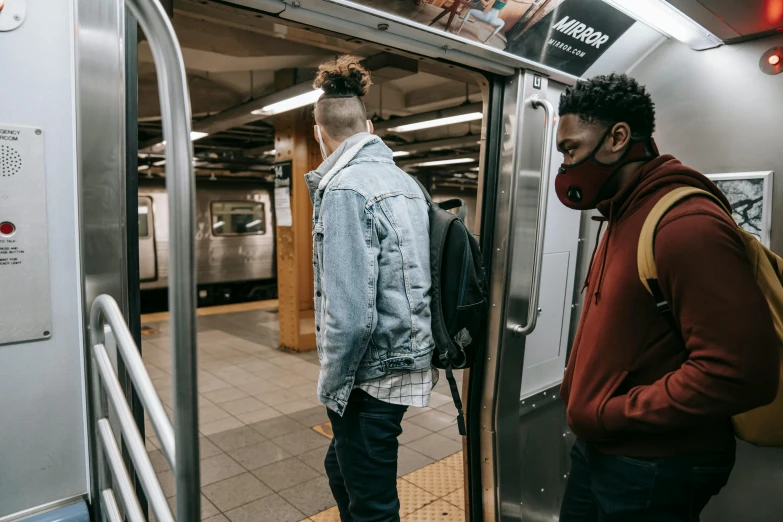 a couple of men standing next to each other on a subway, trending on unsplash, rex orange county, xxxtentacion, wearing facemask, ignant