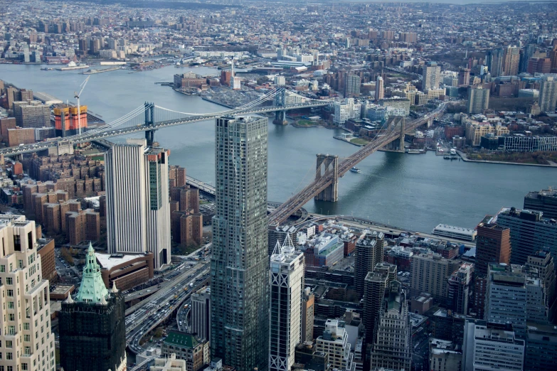 a view of a city from the top of a building, inspired by Thomas Struth, pexels contest winner, lots of bridges, brooklyn, view from helicopter, 2 0 2 2 photo