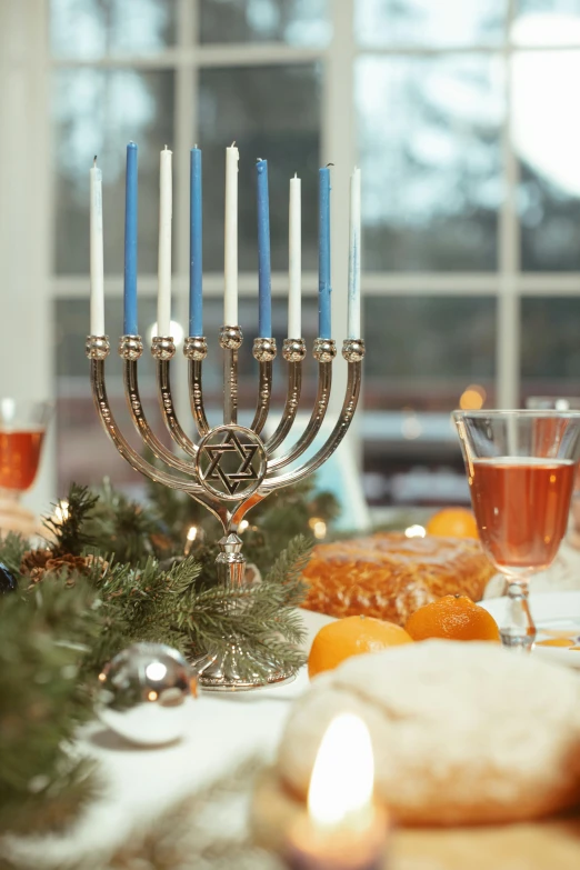a bunch of candles that are on a table, blue and silver, hebrew, holiday vibe, exterior shot