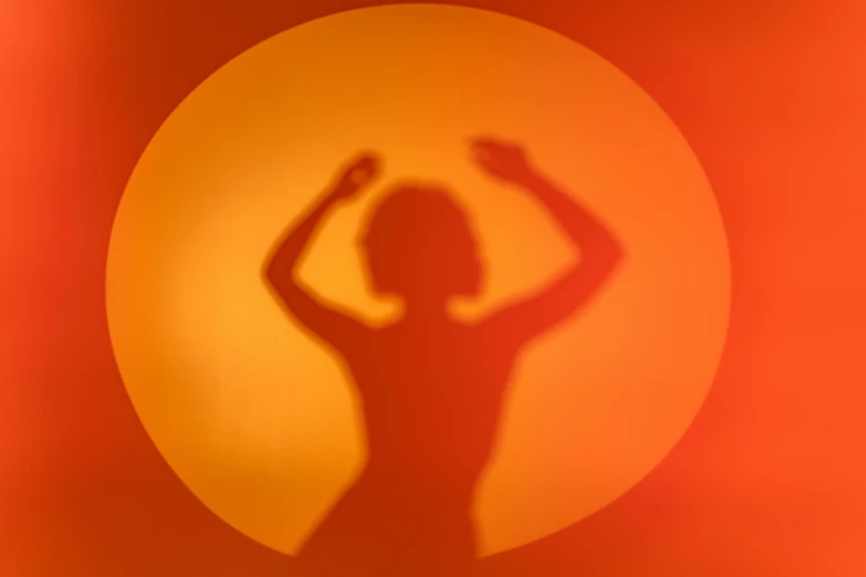 a silhouette of a woman standing in front of a sun, by Ottó Baditz, orange and red lighting, dance meditation, round background, soft shadow