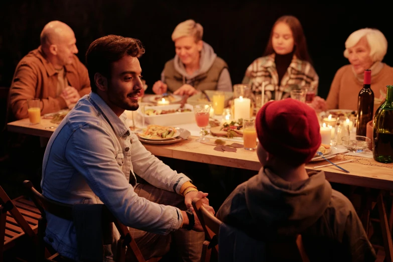 a group of people sitting around a dinner table, set at night, family friendly, profile picture 1024px, actor