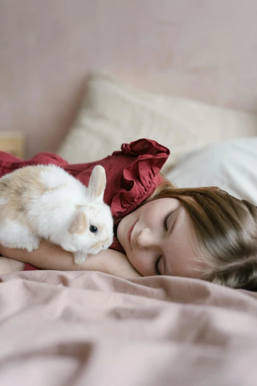 a little girl laying in bed with a bunny, a picture, shutterstock contest winner, romanticism, fennec, 1 6 years old, mini model, breeding