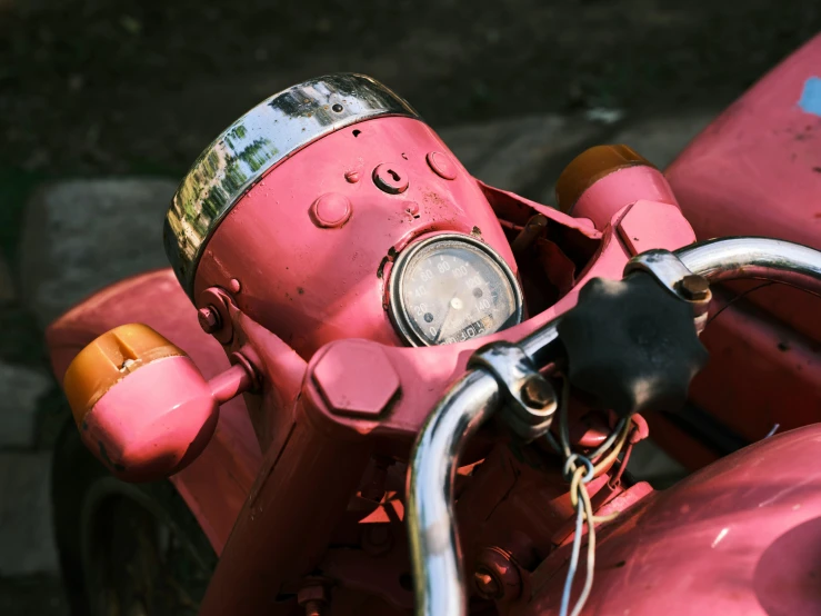 a pink motorcycle parked on the side of the road, pexels contest winner, close-up of a robot sitting down, rusty red helmet, top down view, ((pink))