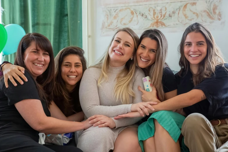 a group of women sitting on top of a couch, by Amelia Peláez, pexels contest winner, happily smiling at the camera, giorgia meloni, nursing, avatar image