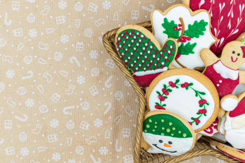 a basket filled with christmas cookies on top of a table, by Emma Andijewska, pexels, naive art, background image, mittens, 3 4 5 3 1, high definition