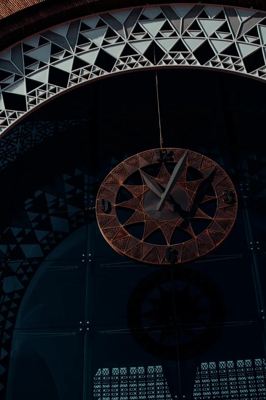 a large clock mounted to the side of a building, a digital rendering, inspired by Petros Afshar, pexels contest winner, intricate detailed roof, 8 k. volumetric lighting. dark, cybermosque interior, taken with sony alpha 9