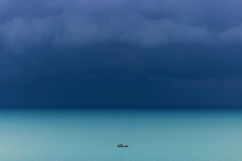 a boat in the middle of a large body of water, a picture, inspired by Storm Thorgerson, unsplash contest winner, minimalism, michael page, with thunderstorms, contemplation, muted color (blues