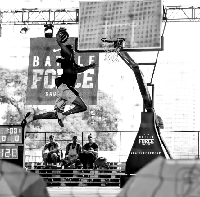 a man that is jumping in the air with a basketball, a black and white photo, dribble, massive vertical grand prix race, active battle zone, f 8, live footage