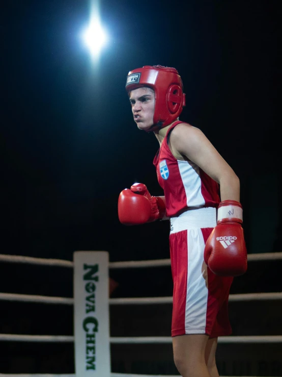 a couple of men standing next to each other in a boxing ring, pexels contest winner, happening, red uniform, profile image, declan mckenna, ( ( theatrical ) )