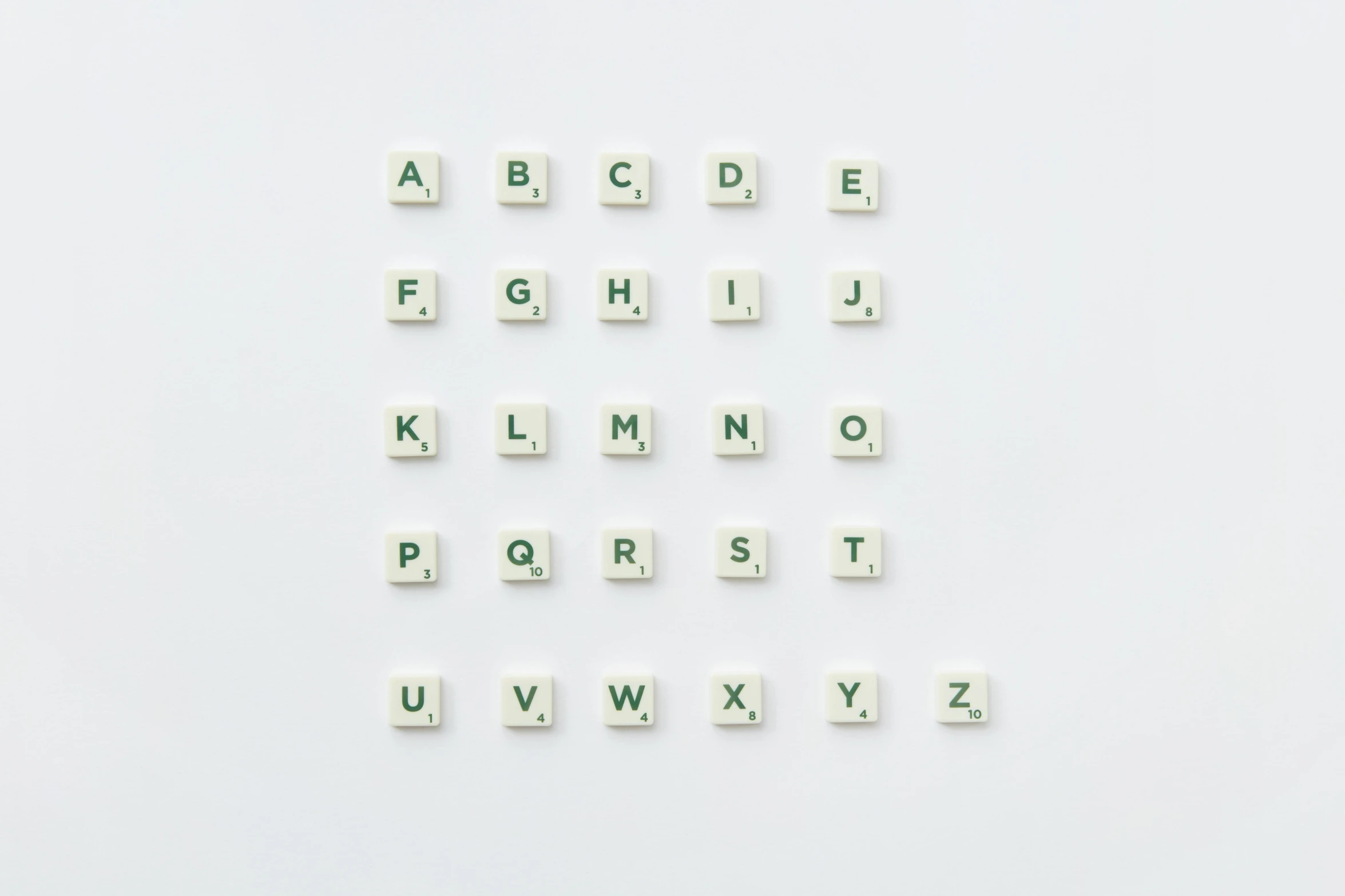 a close up of letters on a white surface, unsplash, 3 2 x 3 2, ffffound, squares, miniature product photo