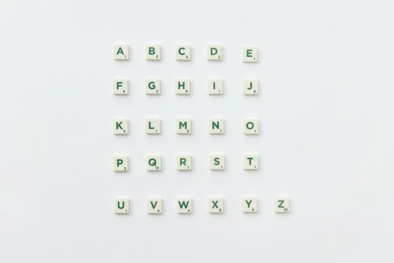 a close up of letters on a white surface, unsplash, 3 2 x 3 2, ffffound, squares, miniature product photo