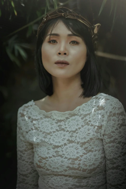 a woman with a crown on her head, an album cover, inspired by Kim Du-ryang, pexels contest winner, lace dress, cinematic headshot portrait, vietnamese woman, medium format. soft light