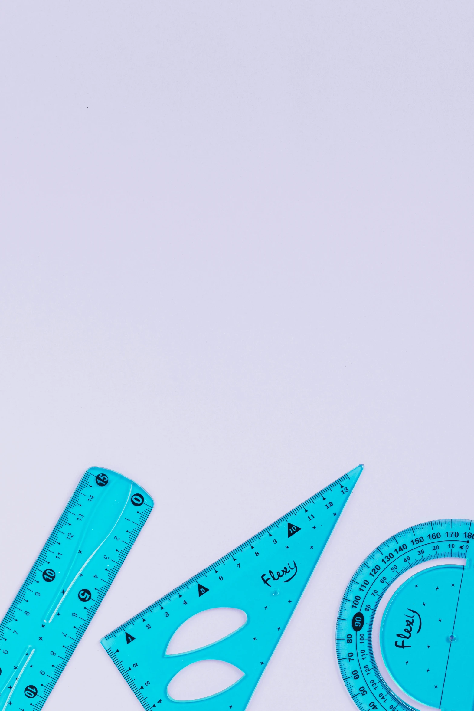 a group of tools sitting on top of a white surface, by Julian Allen, trending on pexels, gradient cyan to purple, math art, teacher, arrow shaped