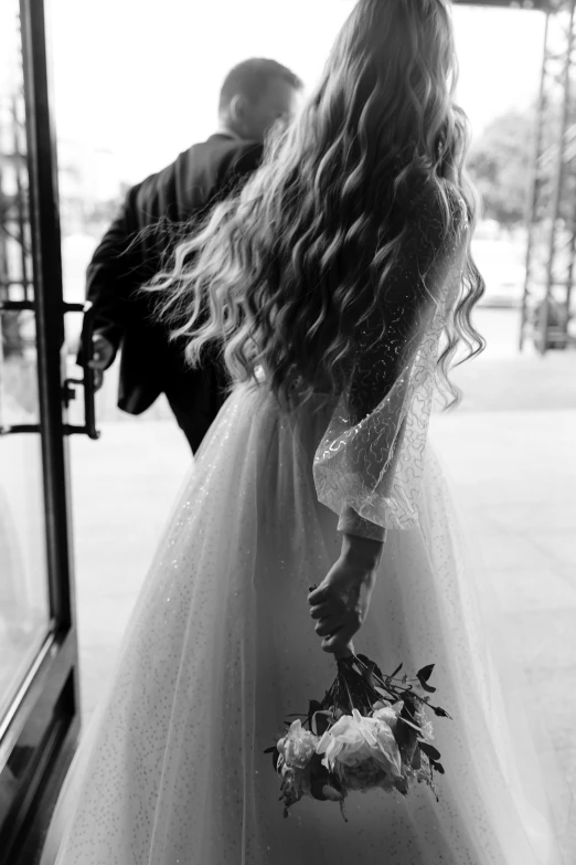 a black and white photo of a woman in a wedding dress, by Silvia Pelissero, pexels contest winner, romanticism, bouquet, man and woman, 15081959 21121991 01012000 4k, curls
