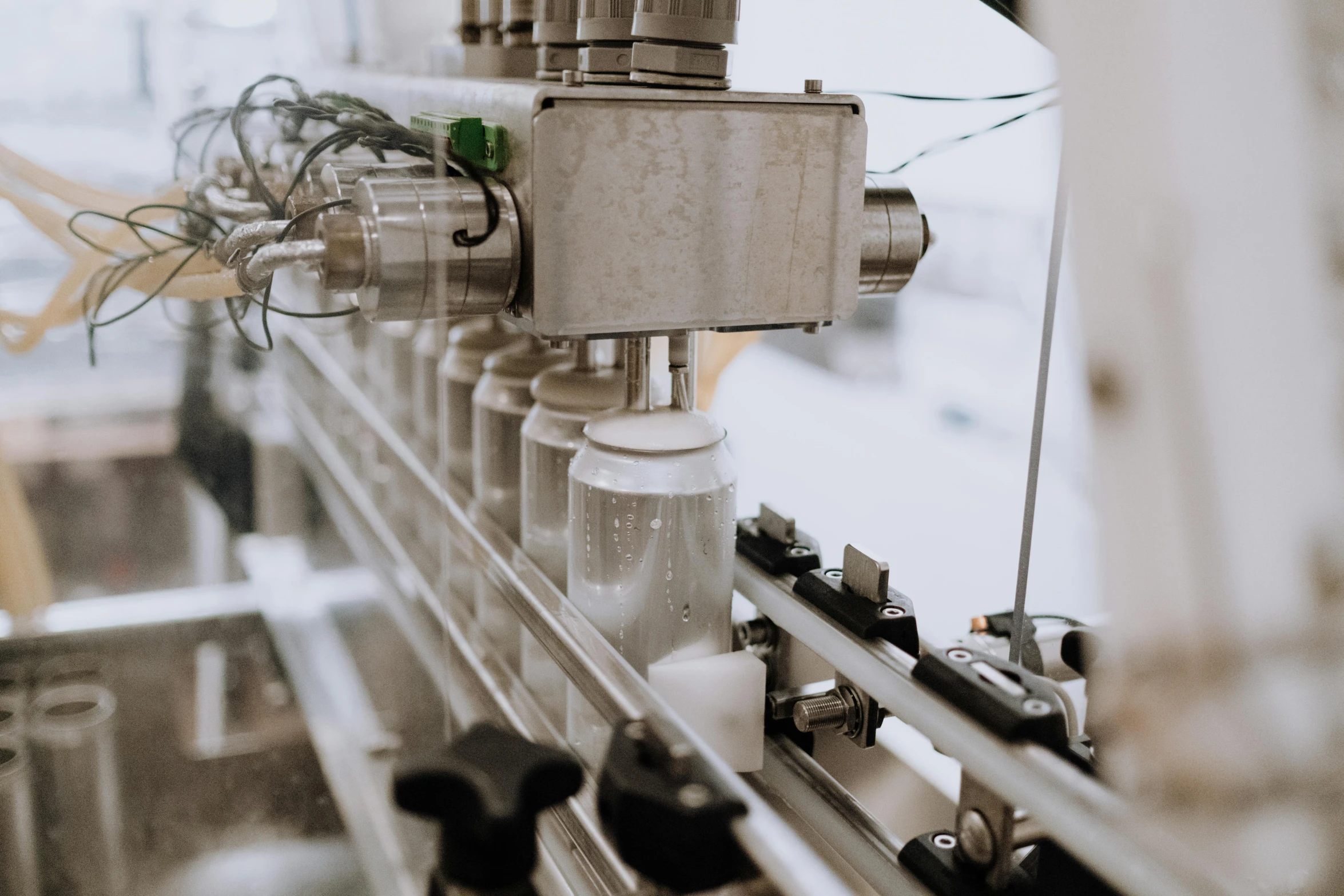 a close up of a machine in a factory, pexels contest winner, sea of milk, vials, grey, white