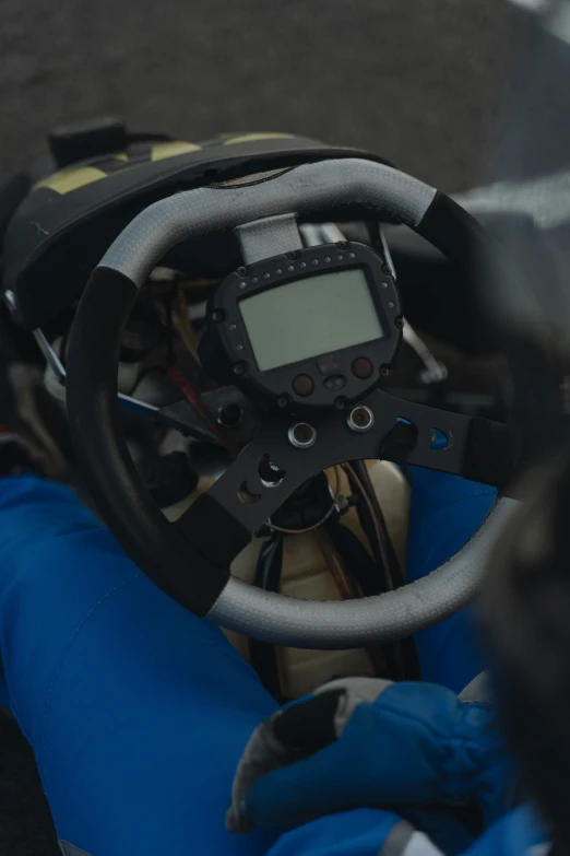 a close up of a person driving a motorcycle, fanatec peripherals, rally driving photo, bjørn skalldrasson, blue