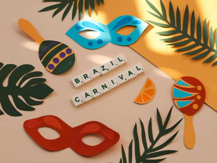 a couple of masks sitting on top of a table, by Amelia Peláez, pexels contest winner, carnival background, lettering, brasil, knolling