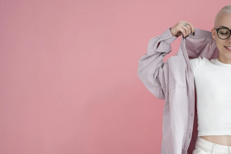 a woman standing in front of a pink wall, inspired by Allan Ramsay, trending on pexels, grey robe, working clothes, 15081959 21121991 01012000 4k, long shirt