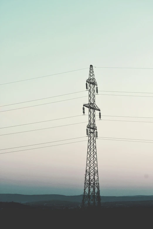 a tall tower sitting in the middle of a field, unsplash, bright thin wires, low quality photo, gradient, stacked image