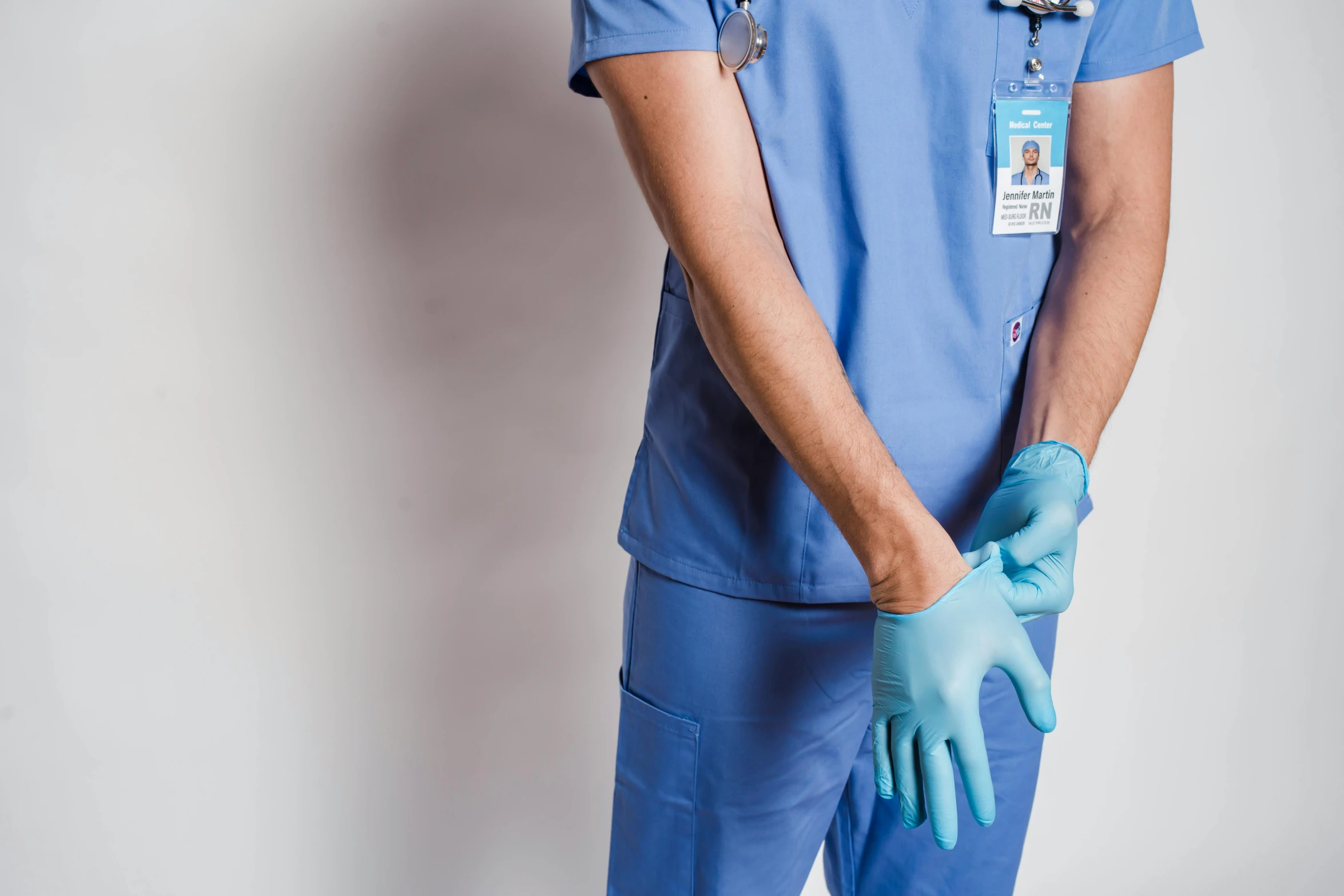 a man wearing a blue scrub suit and blue gloves, trending on pexels, brown, hyperrealistic, medicine, instagram picture