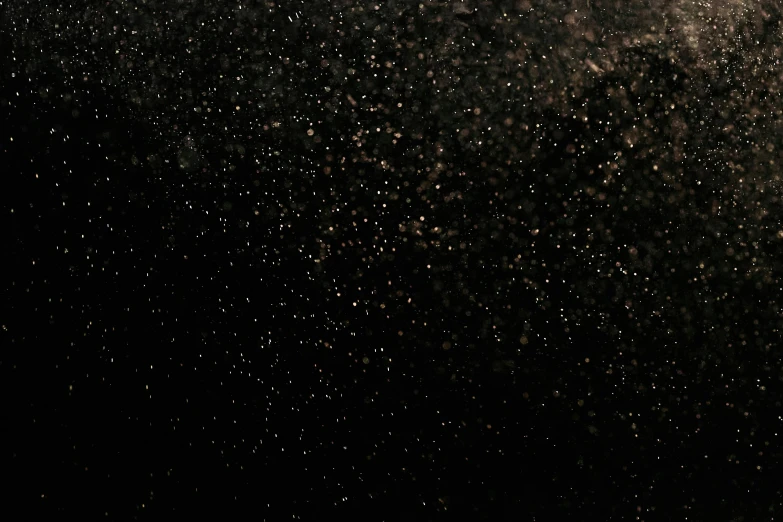 a man riding a snowboard down a snow covered slope, by Attila Meszlenyi, conceptual art, black sky full of stars, metallic bronze skin, background image, glitter gif