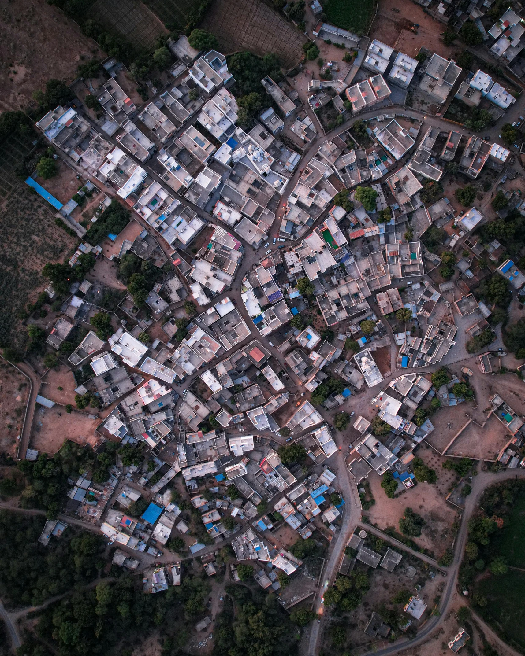 an aerial view of a city with lots of buildings, pexels contest winner, secretly on a village, india, highly detailed 8k photo, stacked image