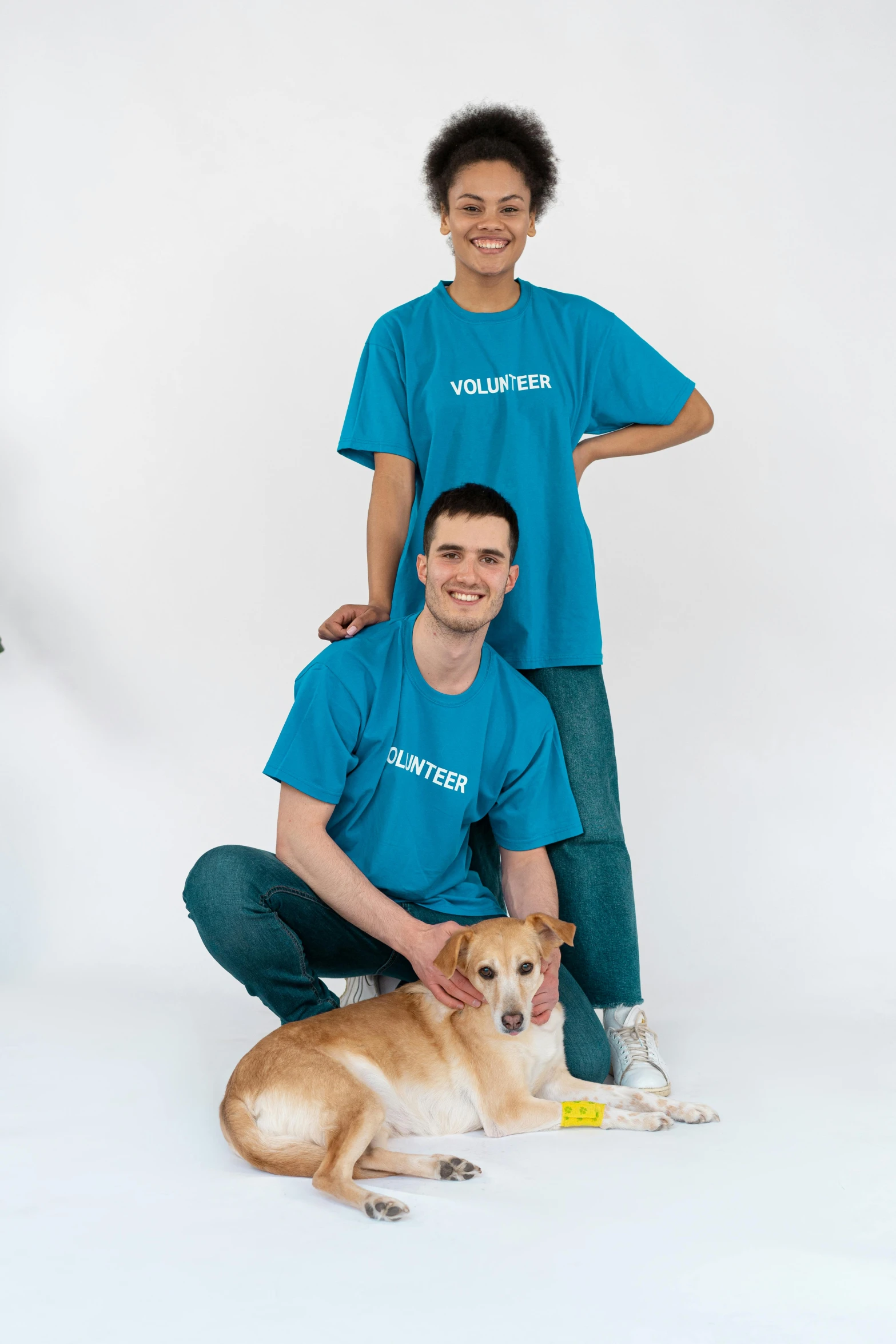 a group of people posing for a picture with a dog, cyan photographic backdrop, adopt, liam brazier, 1 6 years old