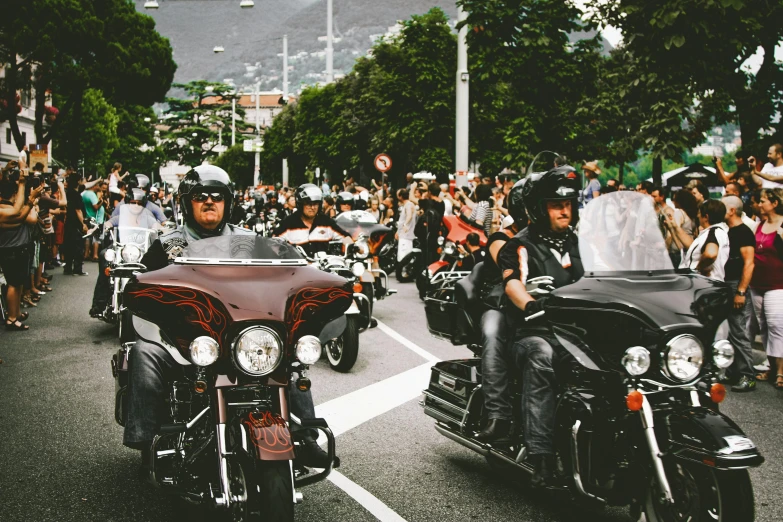 a group of people riding motorcycles down a street, pexels contest winner, chrome hearts, avatar image, inauguration, lachlan bailey