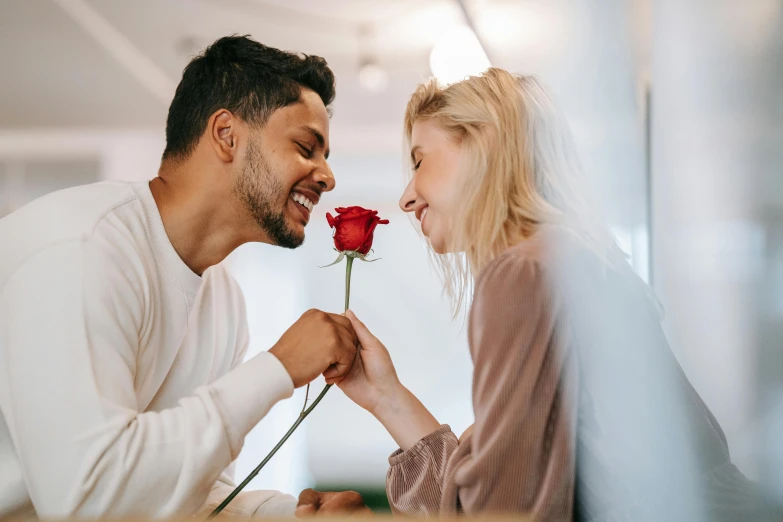 a man giving a flower to a woman, pexels contest winner, dating app icon, all overly excited, white and red roses, profile image