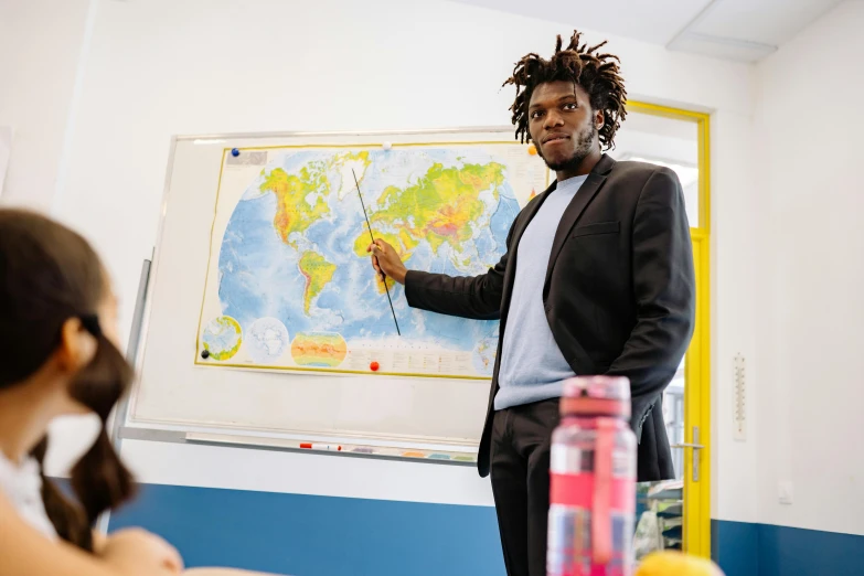 a man standing in front of a whiteboard in a classroom, pexels contest winner, paris school, lil uzi vert, press shot, thumbnail, 1 2 9 7