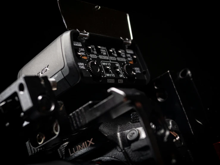 a close up of a camera on a tripod, softly glowing control panels, lux 3 5 fle, studio product shot, apex