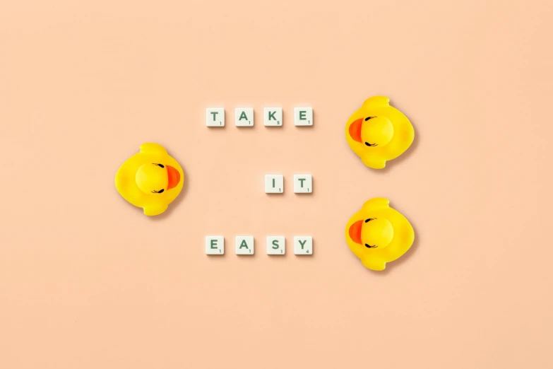 a yellow rubber duck with the words take it easy, an album cover, trending on pexels, minimalism, pills, tesselation, album cover art, 3 4 5 3 1