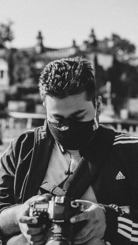 a black and white photo of a man with a camera, reddit, realism, wearing bandit mask, chillhop, avatar image, profile photo