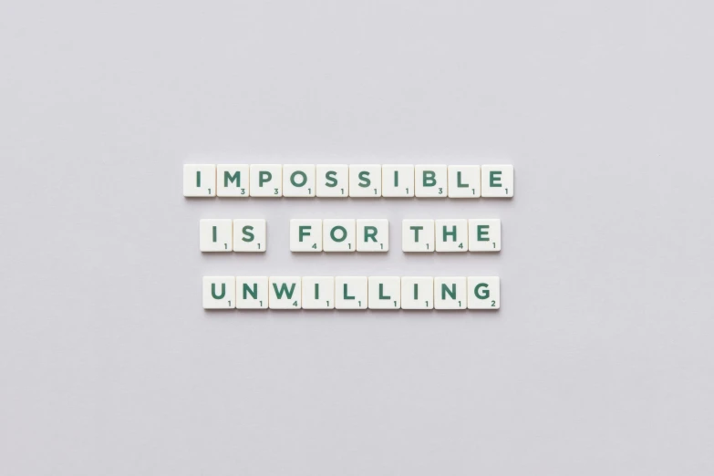 the words impossibleble is for the unwilling are spelled in scrabbles, a picture, unsplash, happening, clean minimalist design, background image, anja millen, lossless