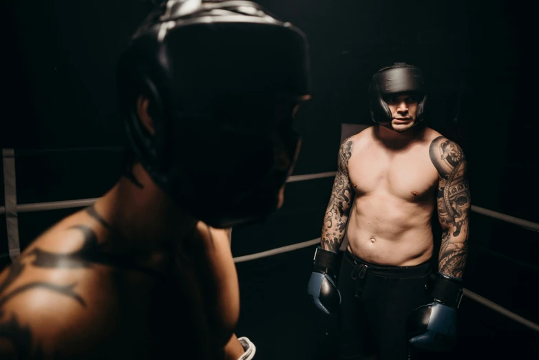 a man standing next to another man in a boxing ring, a tattoo, by Lee Gatch, pexels contest winner, masked person in corner, cinematic bust shot, lachlan bailey, very buff