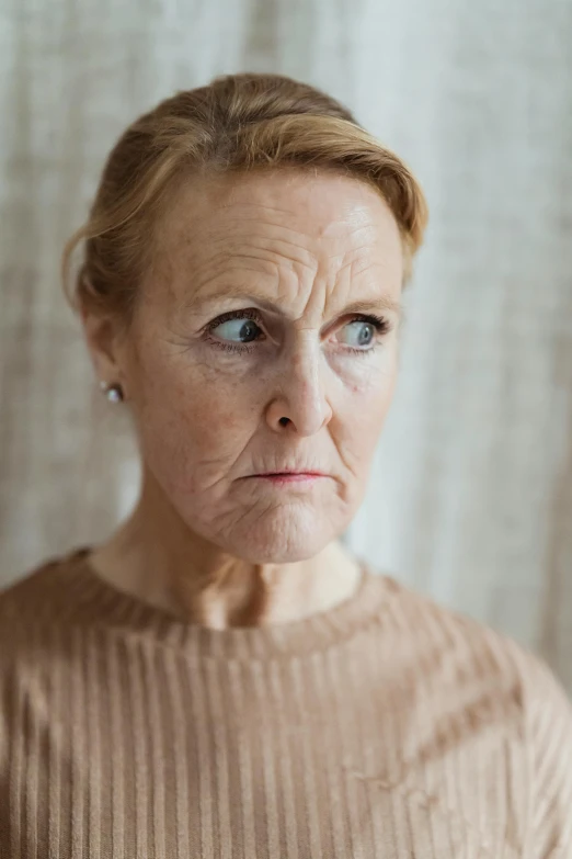 a woman with a concerned look on her face, aging, lynn skordal, sensitive, appalling