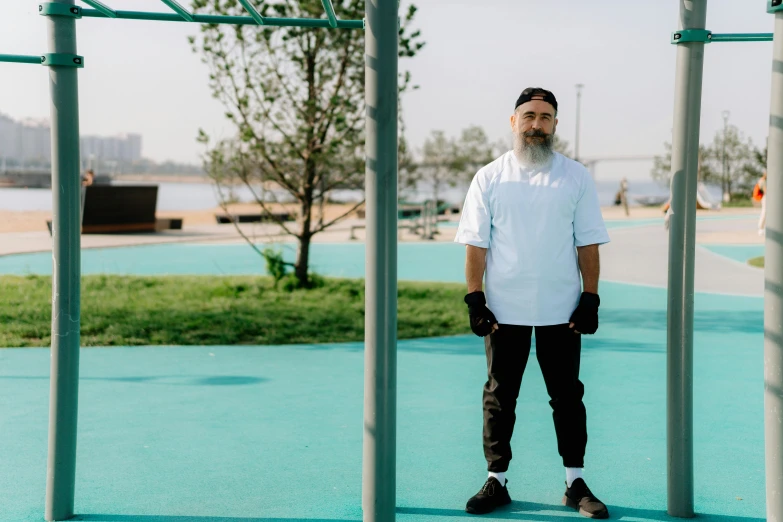 a man standing in the middle of a park, inspired by Weiwei, wearing white chef hat, azamat khairov, bearded and built, on the concrete ground