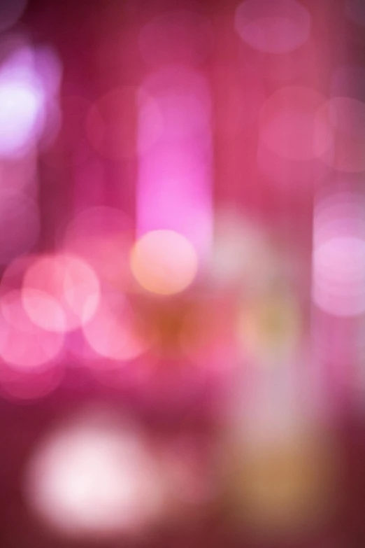 a glass of wine sitting on top of a table, by Sven Erixson, pexels, lyrical abstraction, ((pink)), 4 5 mm bokeh, abstract, light shimmering