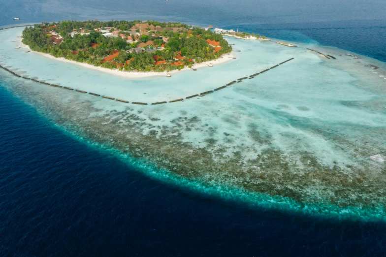 a small island in the middle of the ocean, by Matthias Stom, pexels contest winner, hurufiyya, resort, fish shoal, very elegant & complex, kanamemo