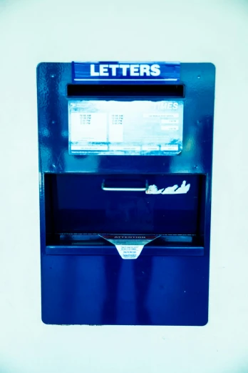 a blue mail box sitting on top of a white wall, an album cover, unsplash, letterism, vending machines, jets, usa, 1 5 9 5