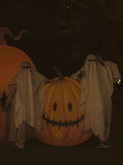a group of people dressed up in halloween costumes, by Attila Meszlenyi, ghostly figure, pumpkins, slide show, scp-106