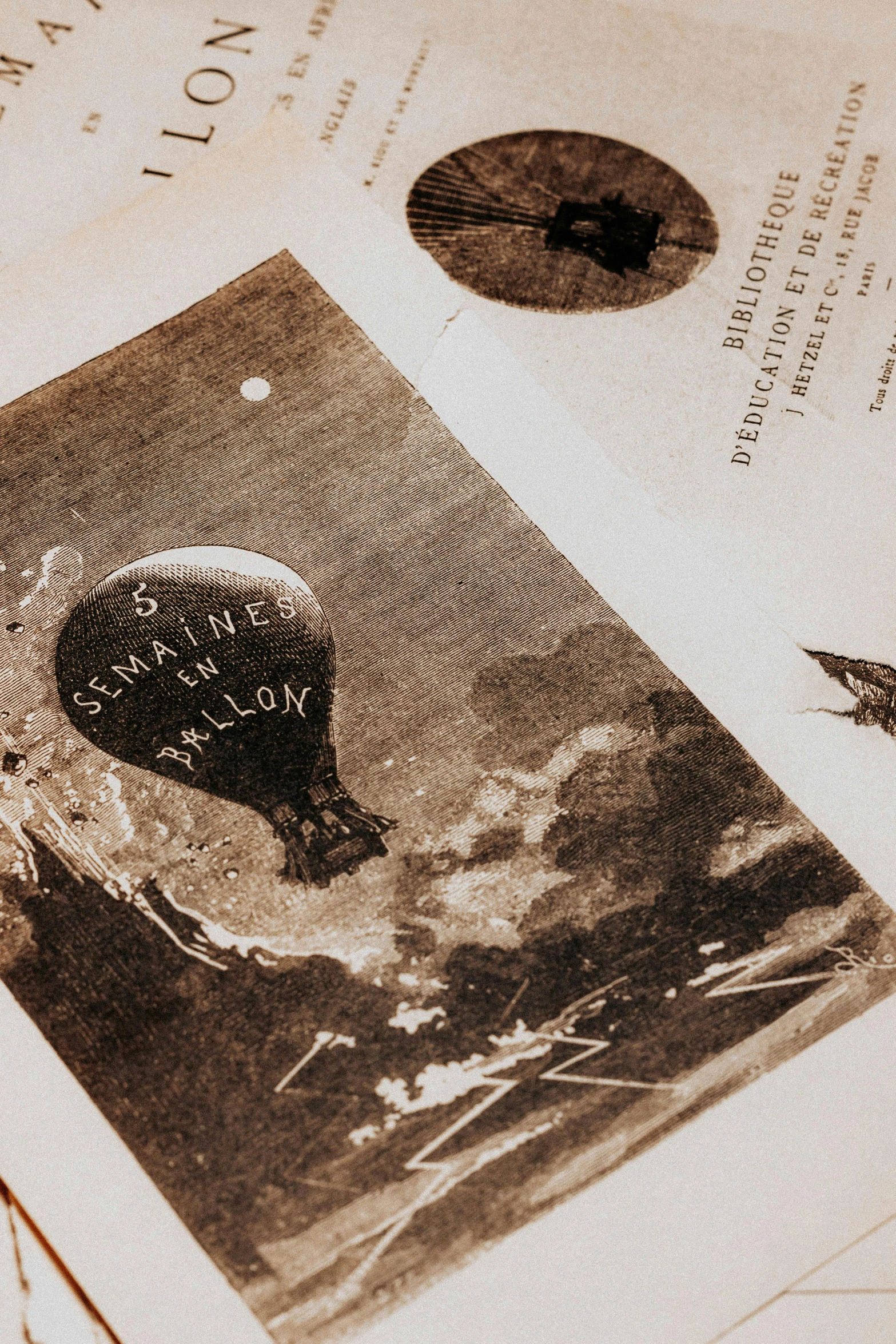 an old black and white photo of a hot air balloon, an album cover, inspired by Théophile Steinlen, pexels contest winner, leonardo davinci detail, printed page, nasa archival photo, ( ( theatrical ) )