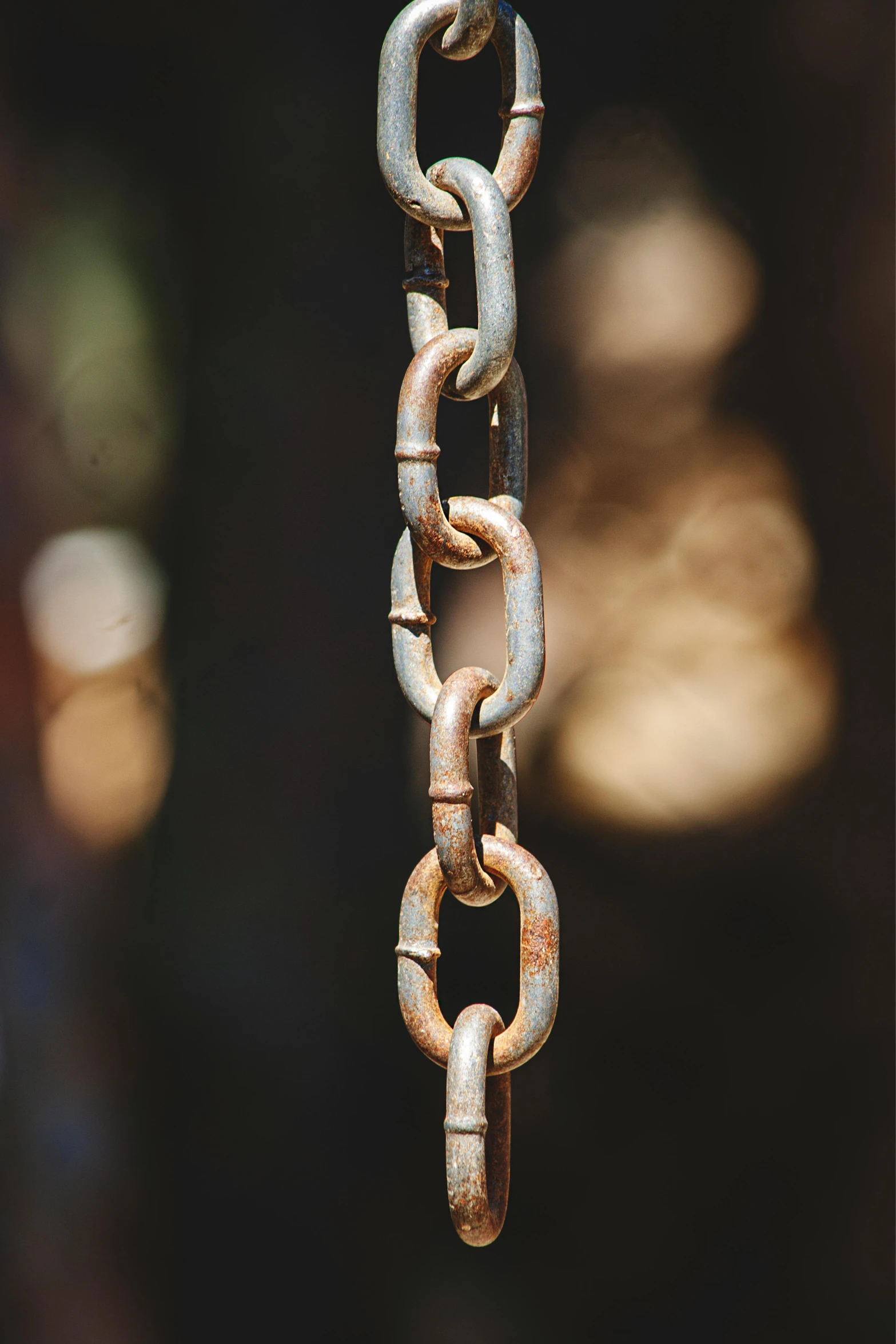 a close up of a chain on a pole, paul barson, rusty metal towers, solidity and eternity, aged 2 5