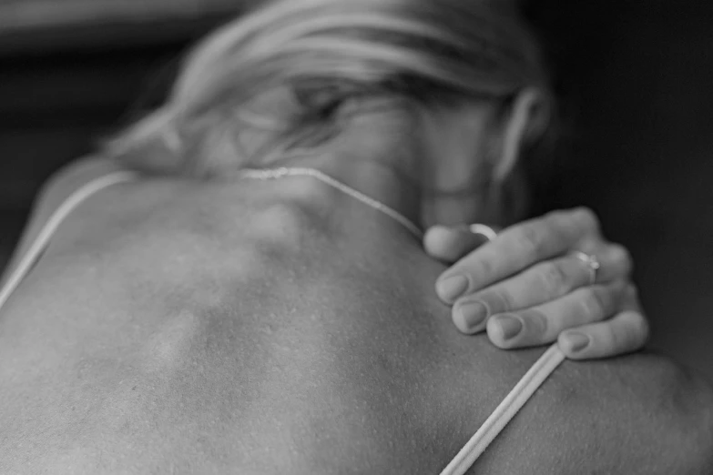 a black and white photo of a woman's back, muscular and exhausted woman, soothing, around a neck, featured