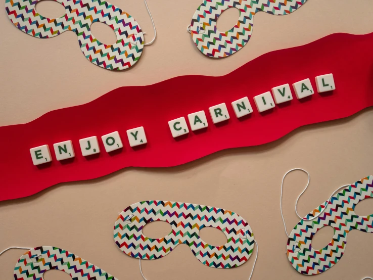 a picture of a sign that says enjoy carnival, inspired by Felice Casorati, pexels contest winner, serial art, emma bridgewater and paperchase, tabletop game board, detail shot, ( ( mask ) )